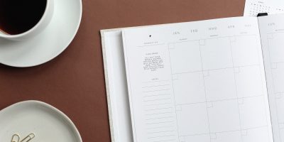 flat lay photography of book and teacup